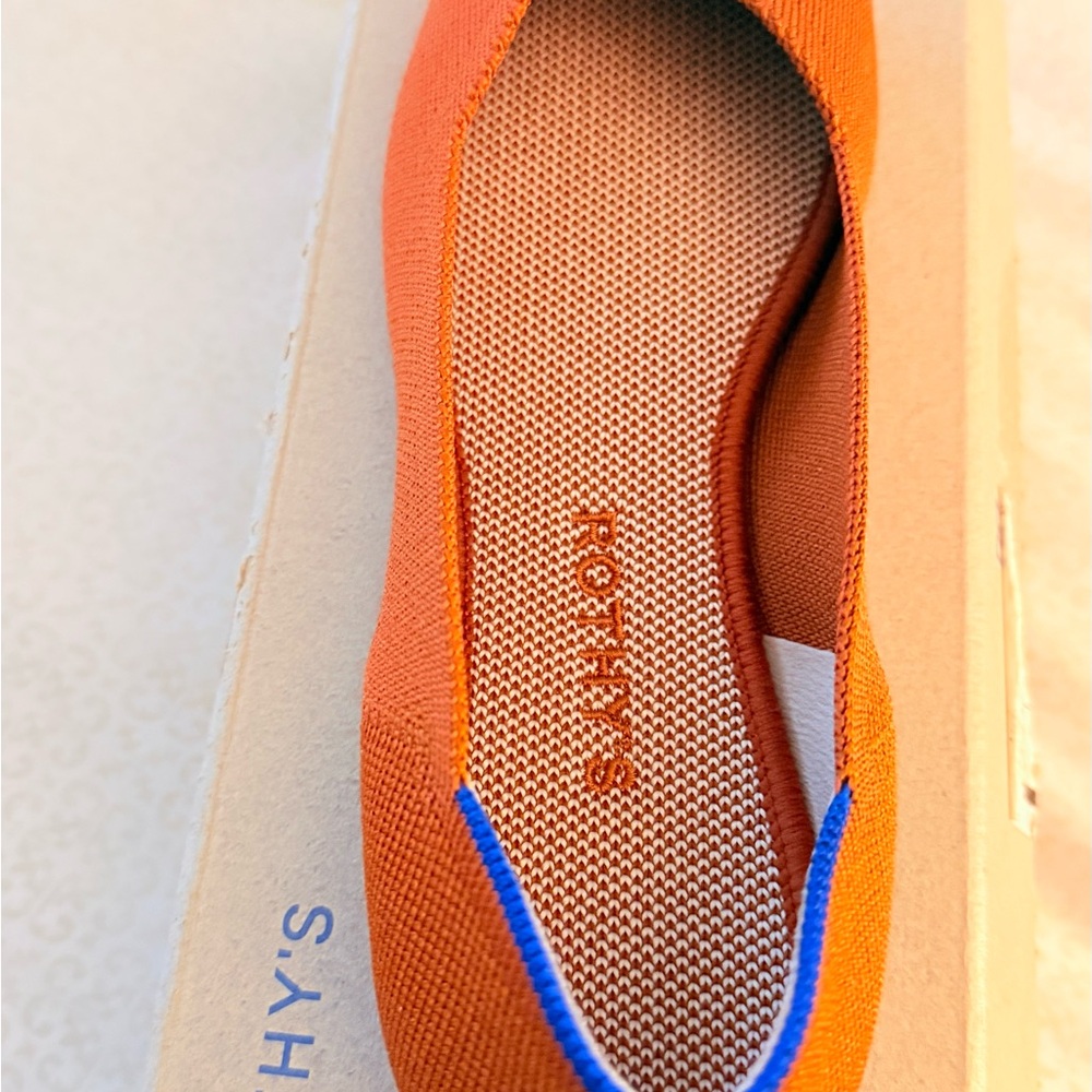 Rothy's Vibrant Orange Flats with Blue Trim